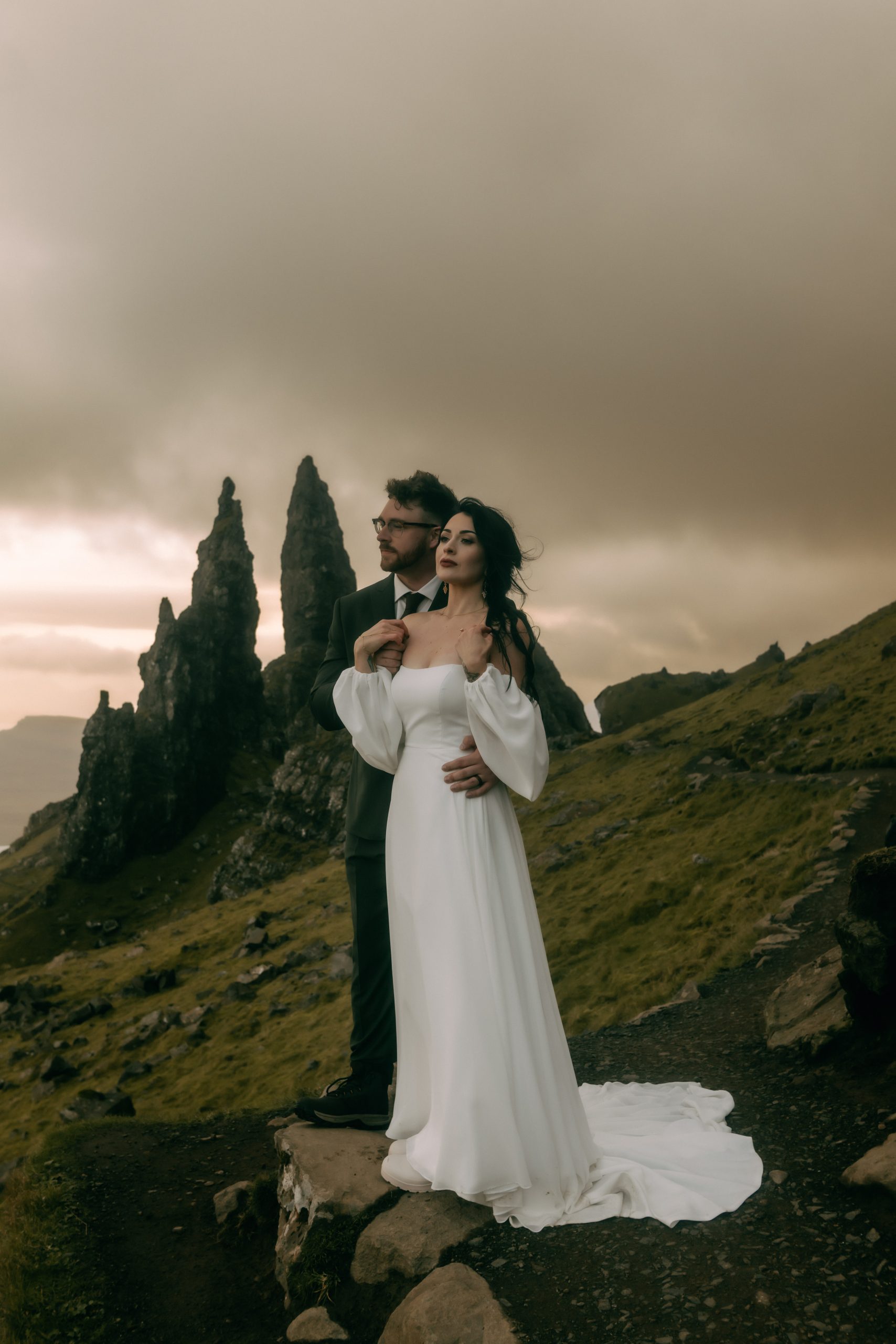 Couple eloping at the Old Man of Storr, captured by Scotland elopement photographer Belle Art Photography.